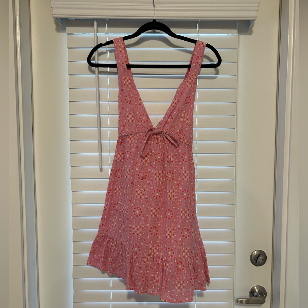 Backless dress with adjustable straps.